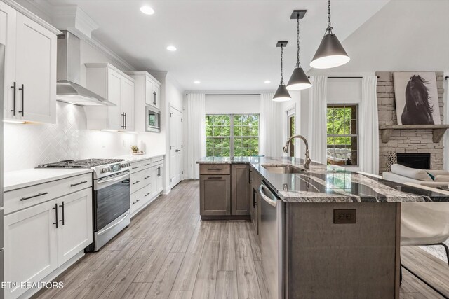 9327 Paradise Valley Ln, Knoxville, TN 37922 - kitchen with appliances with stainless steel finishes, wall chimney exhaust hood, healthy amount of natural light, a spacious island, and recessed lighting