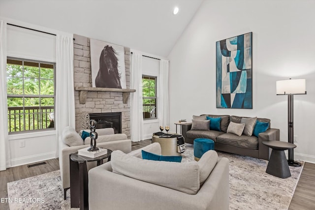 9327 Paradise Valley Ln, Knoxville, TN 37922 - living room featuring wood finished floors, a fireplace, high vaulted ceiling, and recessed lighting