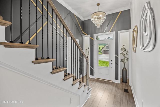 9327 Paradise Valley Ln, Knoxville, TN 37922 - foyer entrance with a chandelier, stairway, ornamental molding, and wood finished floors