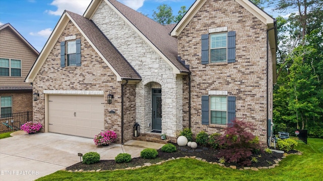 9327 Paradise Valley Ln, Knoxville, TN 37922 - view of front of property featuring concrete driveway, brick siding, and roof with shingles