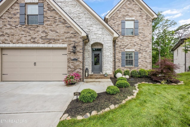 9327 Paradise Valley Ln, Knoxville, TN 37922 - view of front of house featuring concrete driveway, brick siding, and a front lawn
