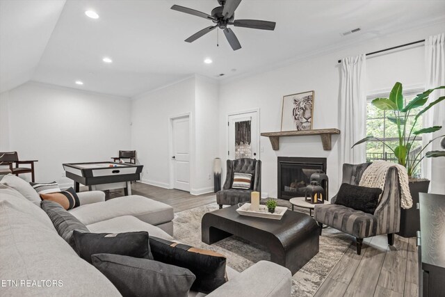9327 Paradise Valley Ln, Knoxville, TN 37922 - living room featuring wood finished floors, ceiling fan, a glass covered fireplace, and recessed lighting