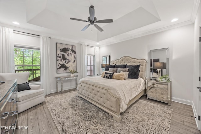 9327 Paradise Valley Ln, Knoxville, TN 37922 - bedroom featuring a tray ceiling, wood finished floors, ornamental molding, recessed lighting, and a ceiling fan