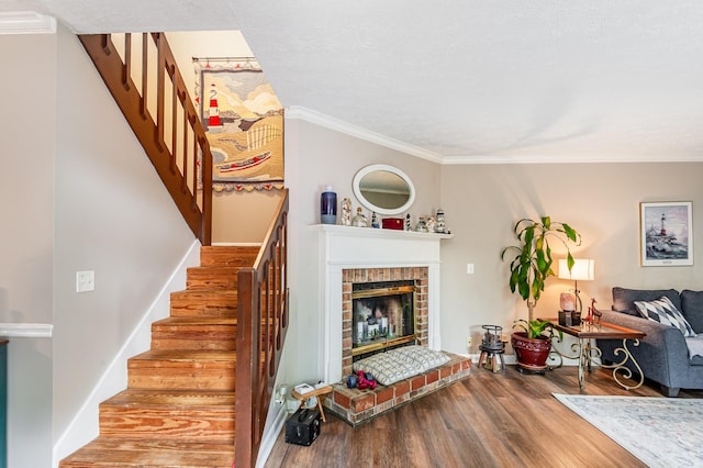 213 Cedarwood Ln, Madison, TN 37115 - stairs with wood finished floors, a brick fireplace, and ornamental molding