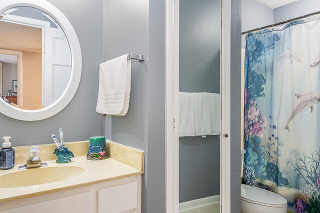 213 Cedarwood Ln, Madison, TN 37115 - bathroom featuring vanity, toilet, and curtained shower