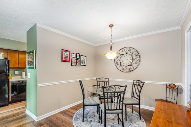 213 Cedarwood Ln, Madison, TN 37115 - dining space featuring wood finished floors, a textured ceiling, baseboards, and ornamental molding