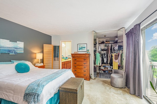 213 Cedarwood Ln, Madison, TN 37115 - bedroom featuring light colored carpet, a walk in closet, a closet, access to exterior, and connected bathroom
