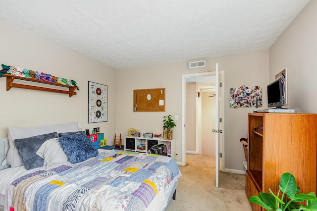 213 Cedarwood Ln, Madison, TN 37115 - bedroom with light carpet, a textured ceiling, and baseboards