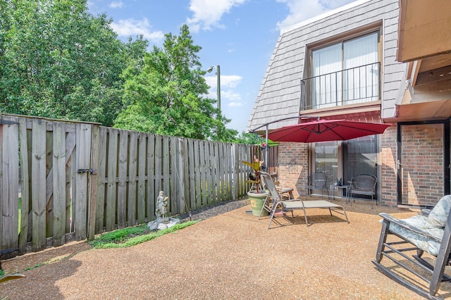 213 Cedarwood Ln, Madison, TN 37115 - fenced backyard with a patio area