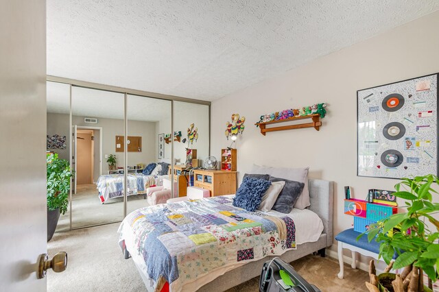 213 Cedarwood Ln, Madison, TN 37115 - carpeted bedroom with a closet and a textured ceiling