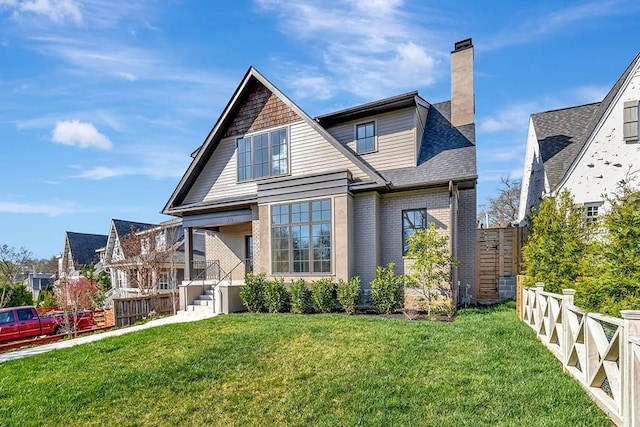 1806 Primrose Ave, Nashville, TN 37212 - rear view of house featuring a chimney, brick siding, and a shingled roof