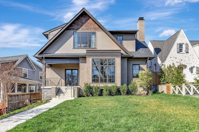 1806 Primrose Ave, Nashville, TN 37212 - back of house featuring brick siding, a chimney, and roof with shingles
