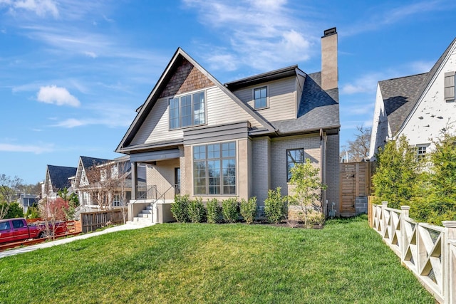 1806 Primrose Ave, Nashville, TN 37212 - rear view of property featuring brick siding, a chimney, and roof with shingles