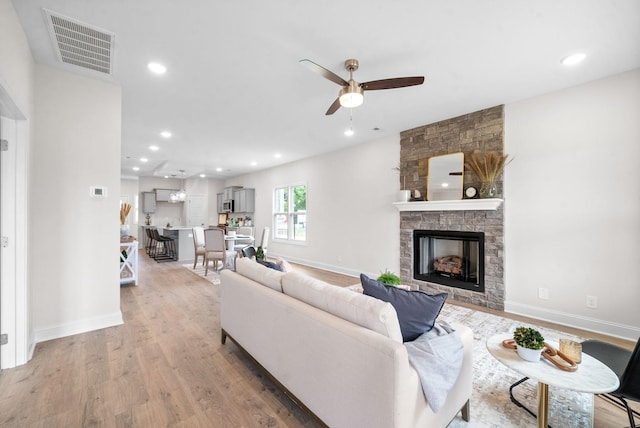 1002 Cherry Acres, Clarksville, TN 37042 - living area with ceiling fan, light wood finished floors, baseboards, a stone fireplace, and recessed lighting