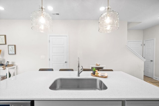1002 Cherry Acres, Clarksville, TN 37042 - kitchen with a sink, decorative light fixtures, and light stone counters