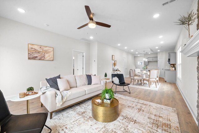 1002 Cherry Acres, Clarksville, TN 37042 - living area with light wood finished floors, a ceiling fan, recessed lighting, and baseboards