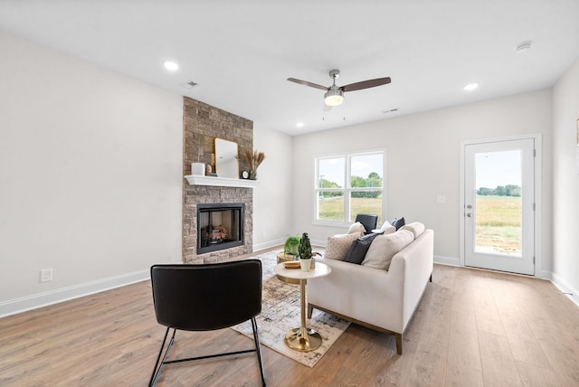 1002 Cherry Acres, Clarksville, TN 37042 - living room featuring light wood finished floors, a stone fireplace, a ceiling fan, baseboards, and recessed lighting