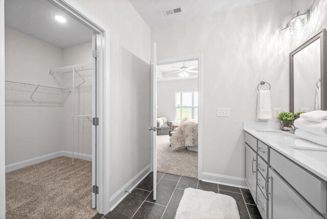 1002 Cherry Acres, Clarksville, TN 37042 - ensuite bathroom with double vanity, baseboards, ceiling fan, and a spacious closet