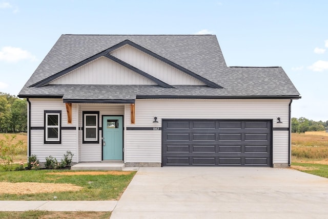 1002 Cherry Acres, Clarksville, TN 37042 - modern inspired farmhouse with an attached garage, concrete driveway, roof with shingles, and a front yard