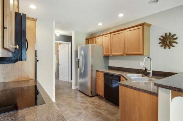 380 Station Dr, Waverly, TN 37185 - kitchen with black appliances, a sink, a peninsula, recessed lighting, and dark stone countertops