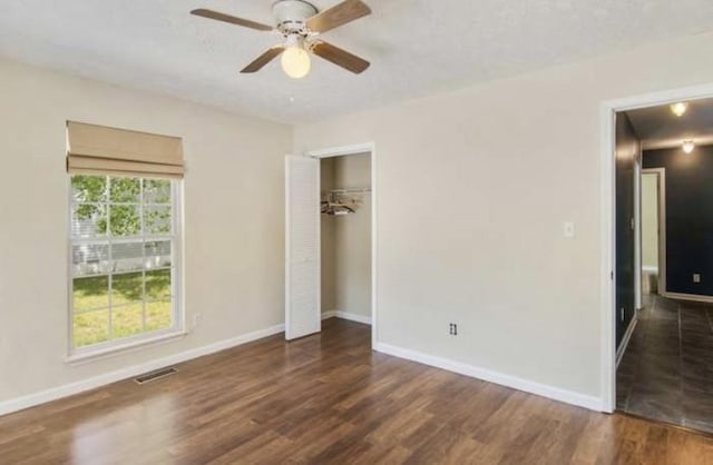 380 Station Dr, Waverly, TN 37185 - unfurnished bedroom featuring wood finished floors and baseboards