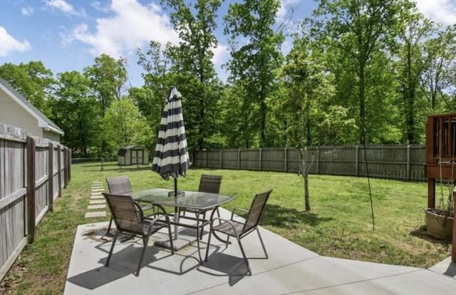 380 Station Dr, Waverly, TN 37185 - view of patio featuring outdoor dining space and view of wooded area