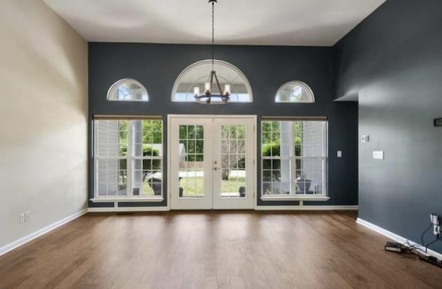 380 Station Dr, Waverly, TN 37185 - entryway with a chandelier, healthy amount of natural light, wood finished floors, baseboards, and a towering ceiling