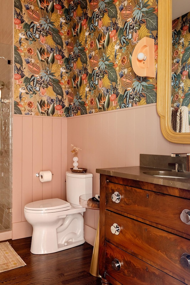 1400 Linden Ave, Nashville, TN 37212 - bathroom featuring vanity, wood finished floors, toilet, a shower stall, and wainscoting