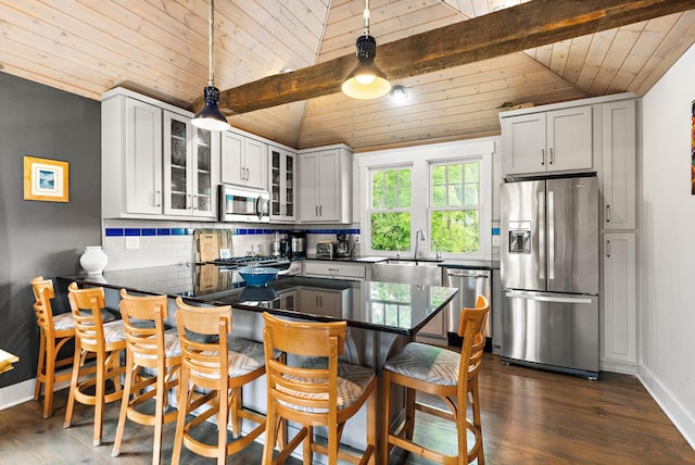 1400 Linden Ave, Nashville, TN 37212 - kitchen with stainless steel appliances, a sink, wood ceiling, dark countertops, and tasteful backsplash