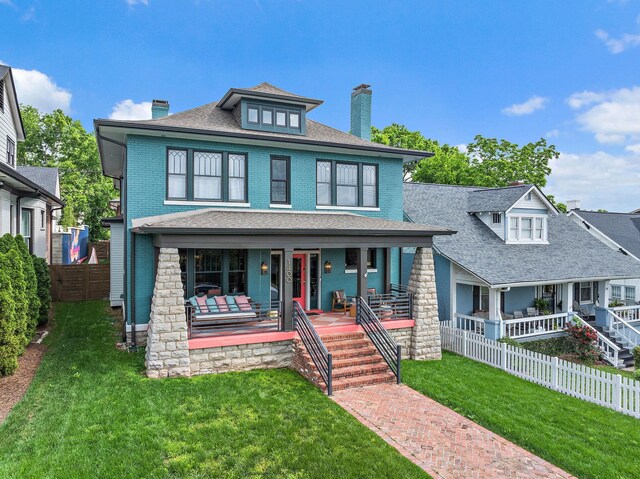 1400 Linden Ave, Nashville, TN 37212 - traditional style home featuring a chimney, covered porch, roof with shingles, and brick siding
