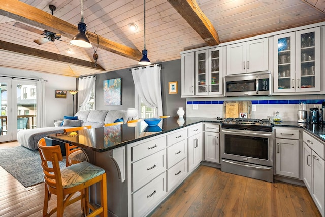 1400 Linden Ave, Nashville, TN 37212 - kitchen with appliances with stainless steel finishes, open floor plan, wood ceiling, a peninsula, and dark countertops