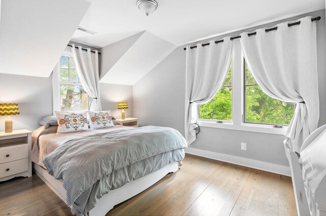 1400 Linden Ave, Nashville, TN 37212 - bedroom with baseboards, wood-type flooring, and vaulted ceiling