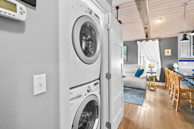 1400 Linden Ave, Nashville, TN 37212 - laundry area featuring stacked washer / dryer, wooden ceiling, wood finished floors, and baseboards