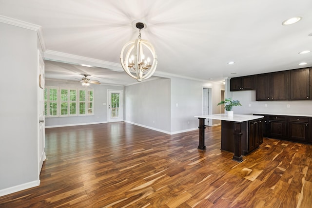 2408 Cantor Way, Spring Hill, TN 37174 - kitchen with a chandelier, dark wood-style flooring, light countertops, crown molding, and baseboards