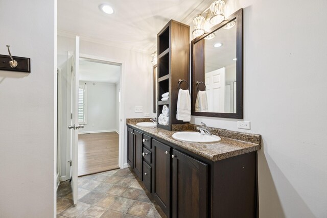 2408 Cantor Way, Spring Hill, TN 37174 - bathroom with double vanity, baseboards, recessed lighting, and ornamental molding