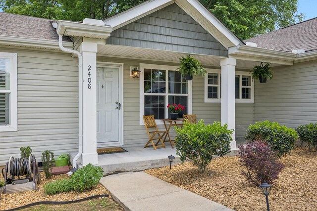 2408 Cantor Way, Spring Hill, TN 37174 - doorway to property featuring a porch and a shingled roof