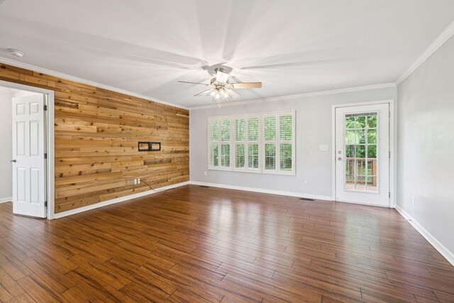 2408 Cantor Way, Spring Hill, TN 37174 - unfurnished living room featuring a ceiling fan, ornamental molding, wood finished floors, baseboards, and wood walls