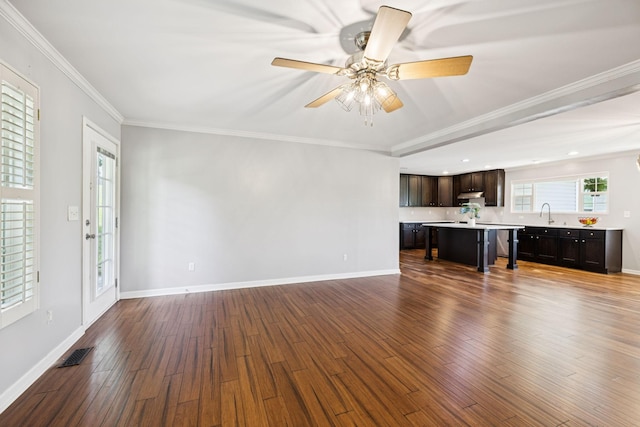 2408 Cantor Way, Spring Hill, TN 37174 - unfurnished living room with wood finished floors, ceiling fan, baseboards, ornamental molding, and a sink