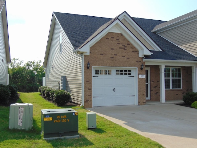 1920 Alysheba Run, Murfreesboro, TN 37128 - view of front of property with brick siding, an attached garage, driveway, and a front lawn