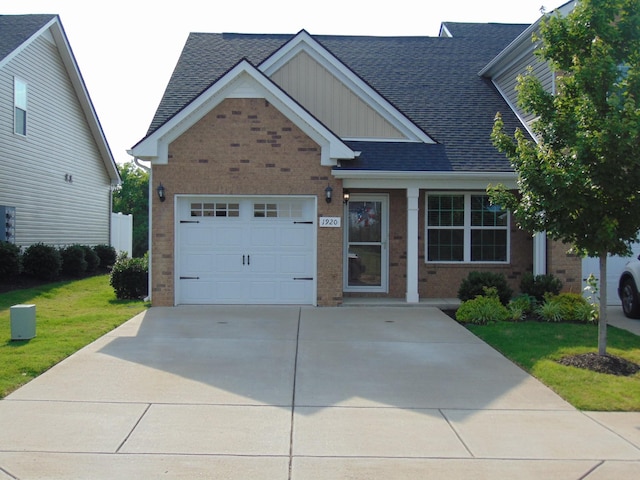 1920 Alysheba Run, Murfreesboro, TN 37128 - view of front of property with brick siding, concrete driveway, a front yard, a garage, and board and batten siding