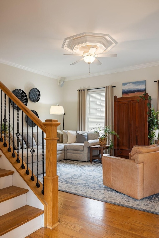 3448 Colebrook Dr, Thompsons Station, TN 37179 - living room featuring crown molding, wood finished floors, a ceiling fan, and stairway