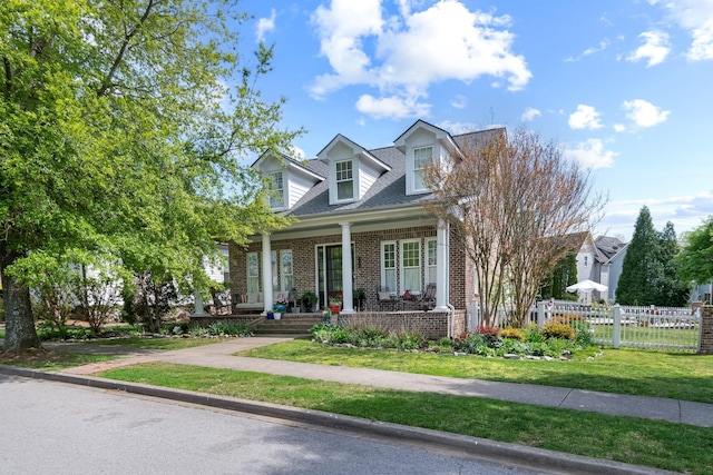 3448 Colebrook Dr, Thompsons Station, TN 37179 - new england style home featuring brick siding, a porch, and roof with shingles
