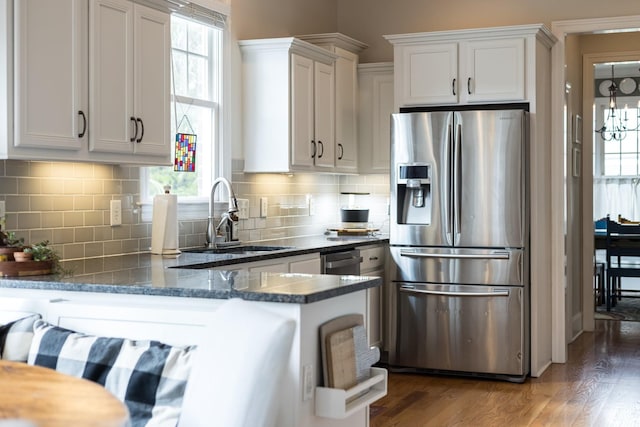 3448 Colebrook Dr, Thompsons Station, TN 37179 - kitchen featuring stainless steel fridge, a sink, white cabinets, wood finished floors, and dark stone countertops