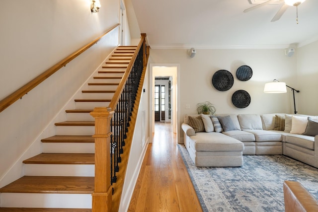 3448 Colebrook Dr, Thompsons Station, TN 37179 - living room with stairs, crown molding, wood finished floors, and a ceiling fan