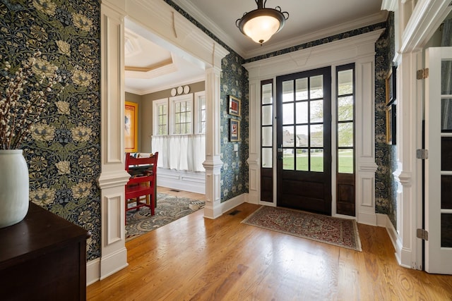 3448 Colebrook Dr, Thompsons Station, TN 37179 - foyer entrance with crown molding, wallpapered walls, healthy amount of natural light, wood finished floors, and baseboards