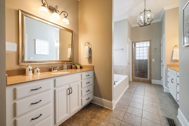 3448 Colebrook Dr, Thompsons Station, TN 37179 - full bathroom featuring ornamental molding, vanity, baseboards, a chandelier, and a garden tub