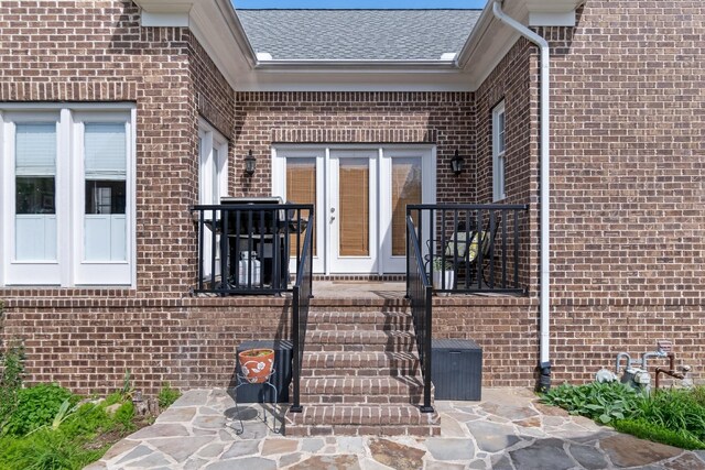 3448 Colebrook Dr, Thompsons Station, TN 37179 - doorway to property with brick siding, a shingled roof, and french doors
