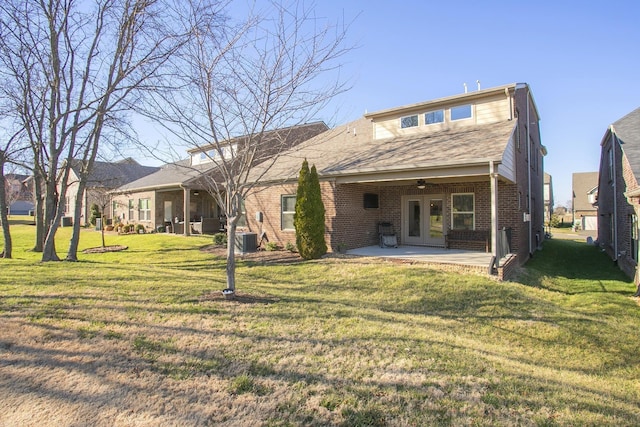 1016 Fenner Ln, Gallatin, TN 37066 - rear view of property featuring ceiling fan, brick siding, a patio area, a lawn, and central AC