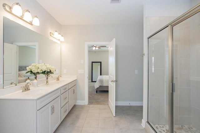 1016 Fenner Ln, Gallatin, TN 37066 - ensuite bathroom with double vanity, ceiling fan, a shower stall, tile patterned flooring, and baseboards
