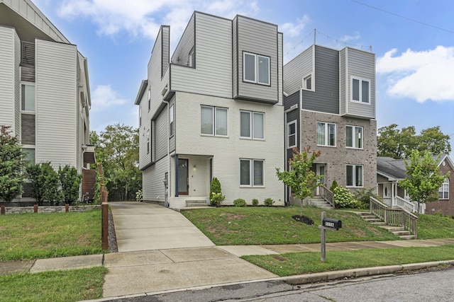 525 31st Ave N Unit A, Nashville, TN 37209 - view of front facade featuring brick siding and a front yard